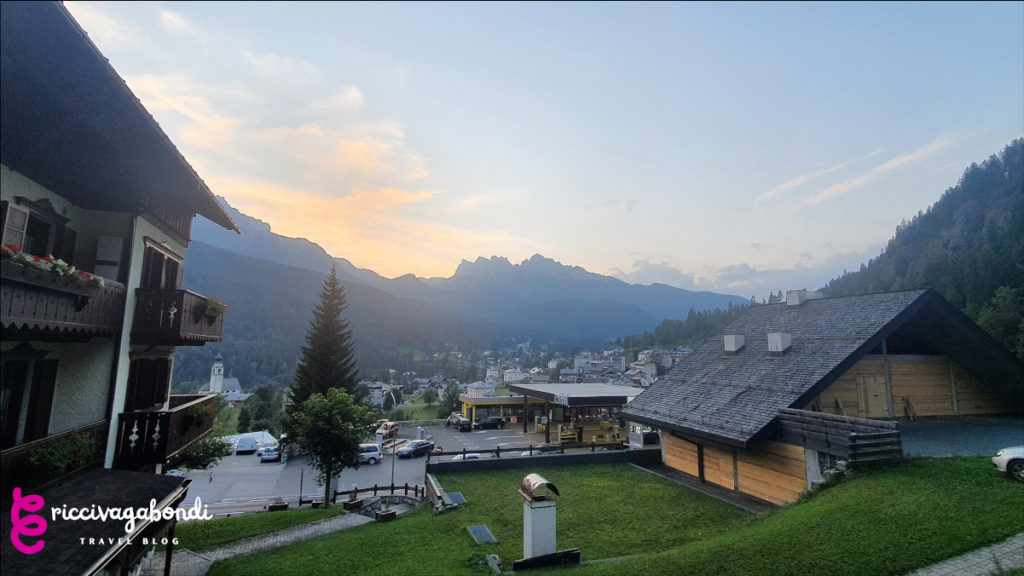 View of the Cadore valley from from Borca di Cadore and traditional housing at sunset