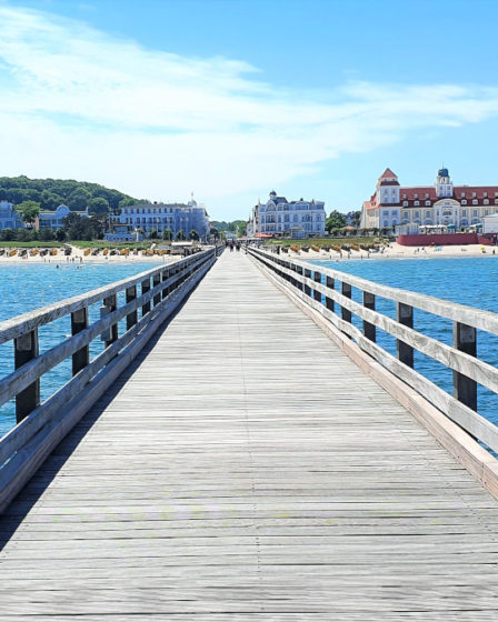 View of the Binz pier on Rügen island surrounded by water on a sunny day
