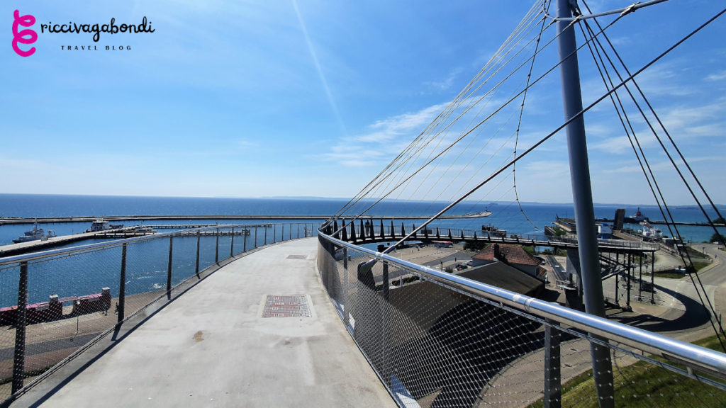 View of the hanging bridge in Sassnitz on Rügen island on a sunny day with breakwater on the background