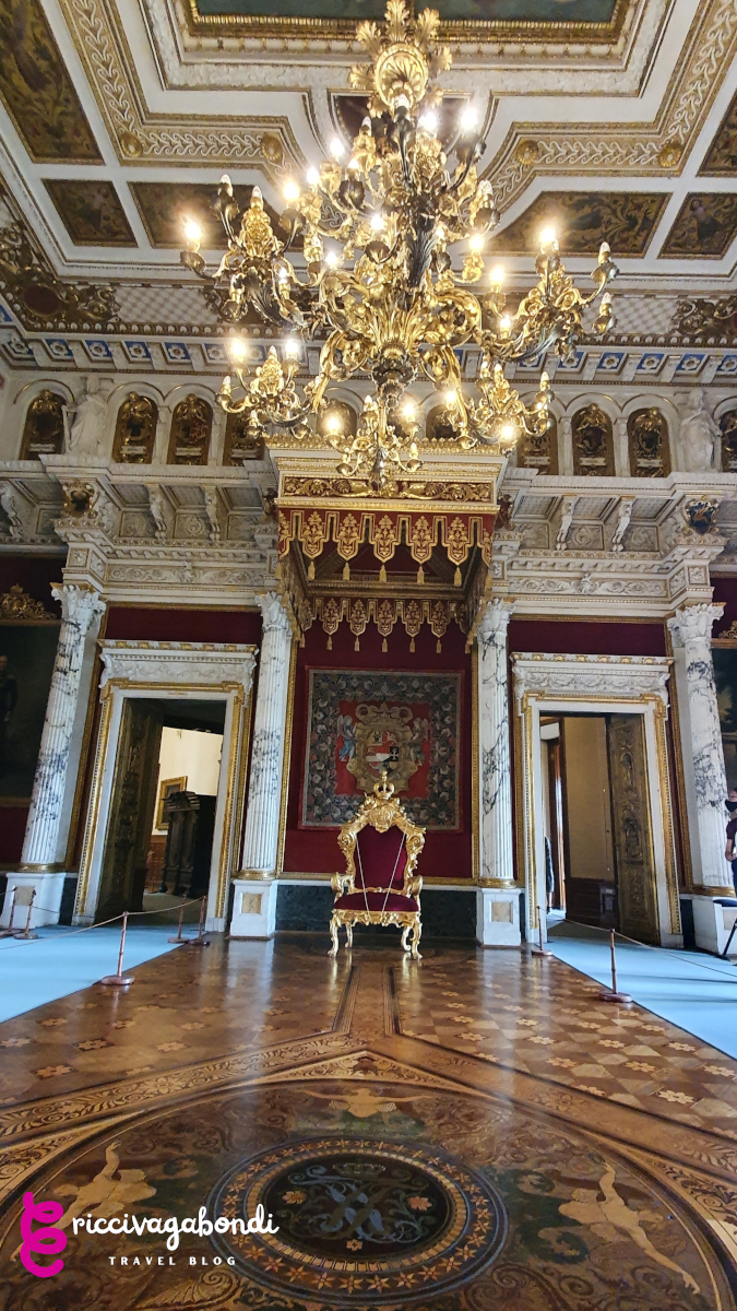 View of the throne room in the Schwerin castle with elegant parquet and giant golden chandelier