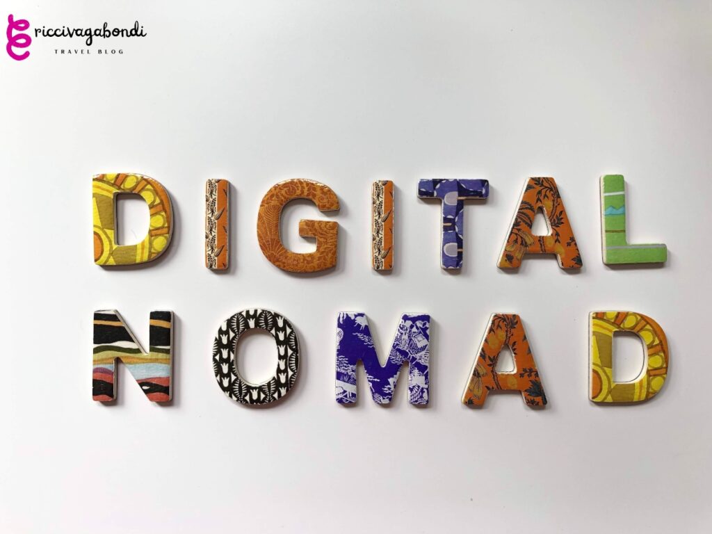 Colourful letters writing "Digital Nomad" on white background.