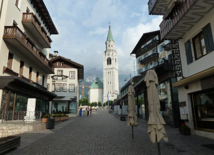 Main street and church bell in Cortina d'Ampezzo, Dolomites, Italy